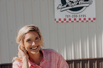 Owner Mariah in front of her building