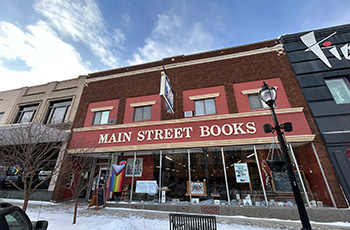photo of outside of business - red brick building