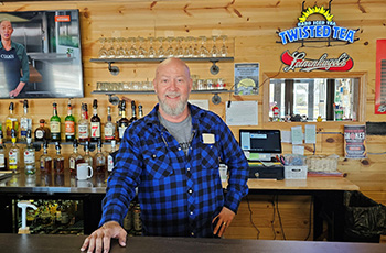 photo of owner in his bar