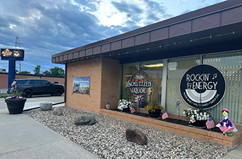 Outside of business building with rocks and sidewalk